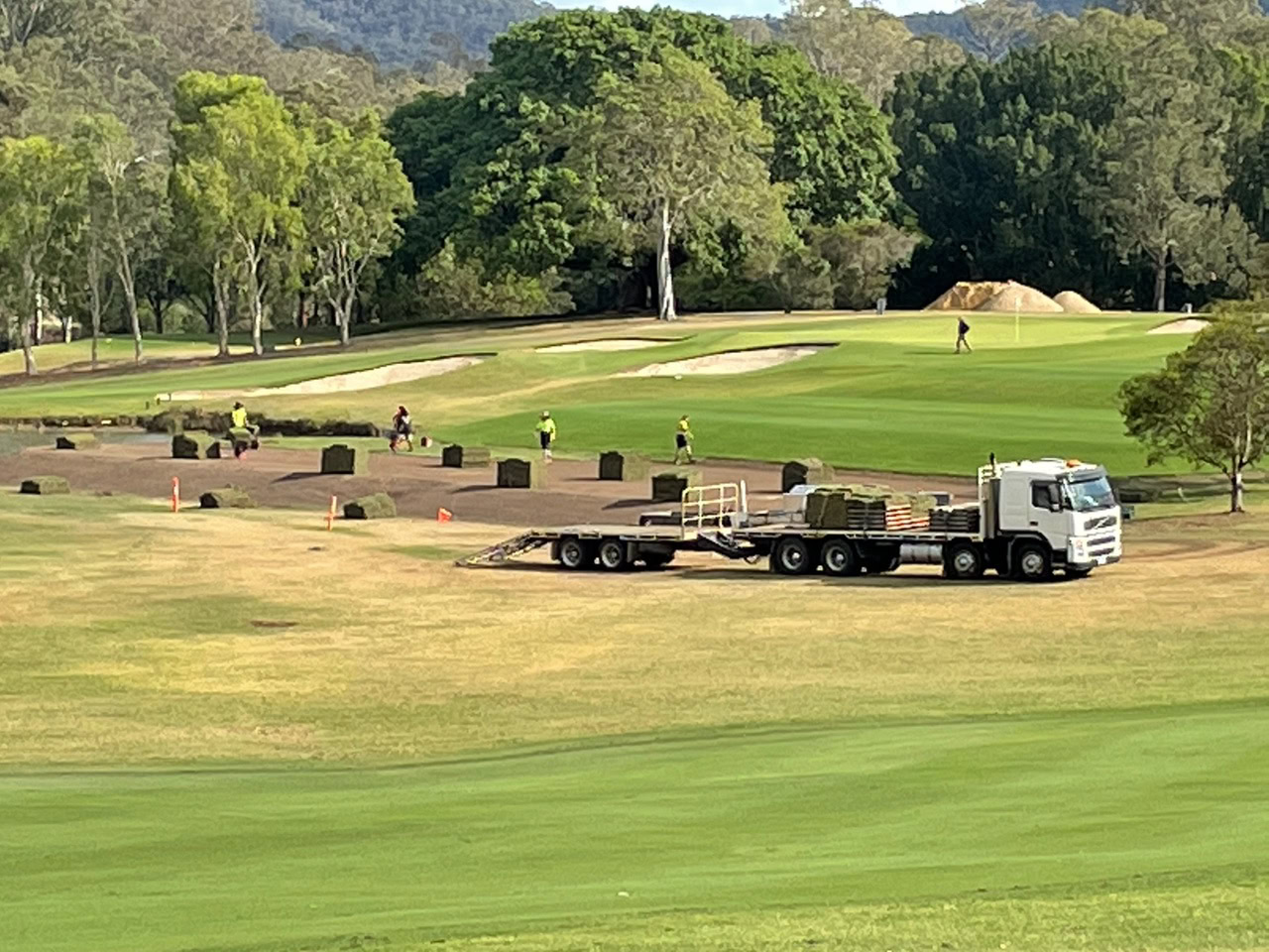 Truck at golf course installing turf