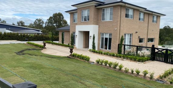 large house with grassy front yard