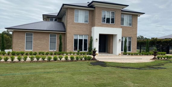 large house with grassy front yard